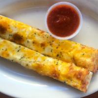 Cheezy Weezy (2 Pcs.) · Topped with Mozzarella, Cheddar, and Romano.