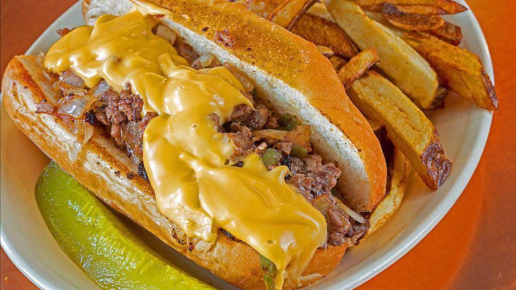 Philly Steak · grilled peppers, onions, and nacho cheese, served on a hoagie.