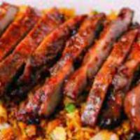 Boneless Spare Ribs · Served with pork fried rice or white rice and egg roll or crab rangoon.