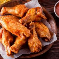 Jumbo Wings · Mouthwatering house chicken wings, fried to a perfect crisp and smothered in customer's choi...