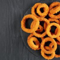 Whiskey Battered Onion Rings · Sweet yellow onions tossed in light beer and whiskey batter, served pipin' hot!