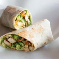 Loaded Caesar Wrap · Signature house wrap prepared with Romaine lettuce, bacon bits, diced hardboiled egg, Parmes...
