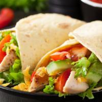 Cilantro Lime Chicken Wrap · Signature house wrap prepared with mixed greens, grilled chicken breast, black beans, pico d...