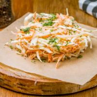 Coleslaw · House coleslaw prepared with shredded lettuce, cabbage, and carrots, and mixed in a blend of...