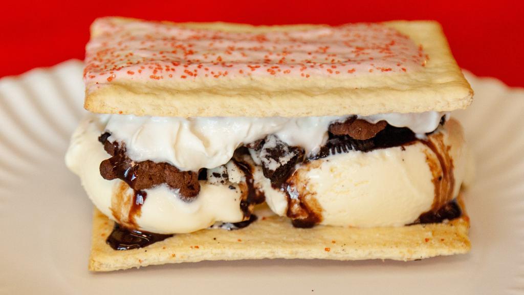 Pop Tart Ice Cream Sandwich · Two scoops of ice cream, with 2 toppings and whip cream and syrup sandwiched between 2 pieces of Pop Tarts.