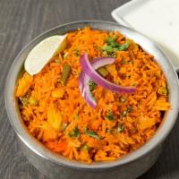 Vegetable Biryani · Basmati rice, vegetables and saffron. Served with raita.
