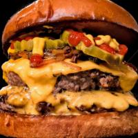 Classic Smash · Two beef patties, American cheese, grilled onion, pickle, ketchup, mustard.
