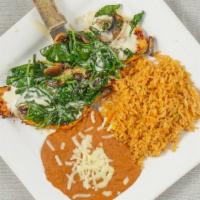 Pollo Jalisco · Spinach and mushrooms atop grilled chicken strips, covered with melted cheese and offered wi...