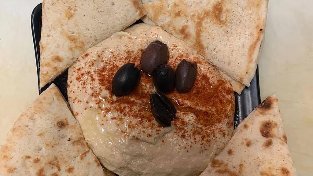 World Class Hummus · Gluten free. Our hummus is made from scratch. Beans cooked on-site with fresh ingredients. (pictured with kalamata olives).