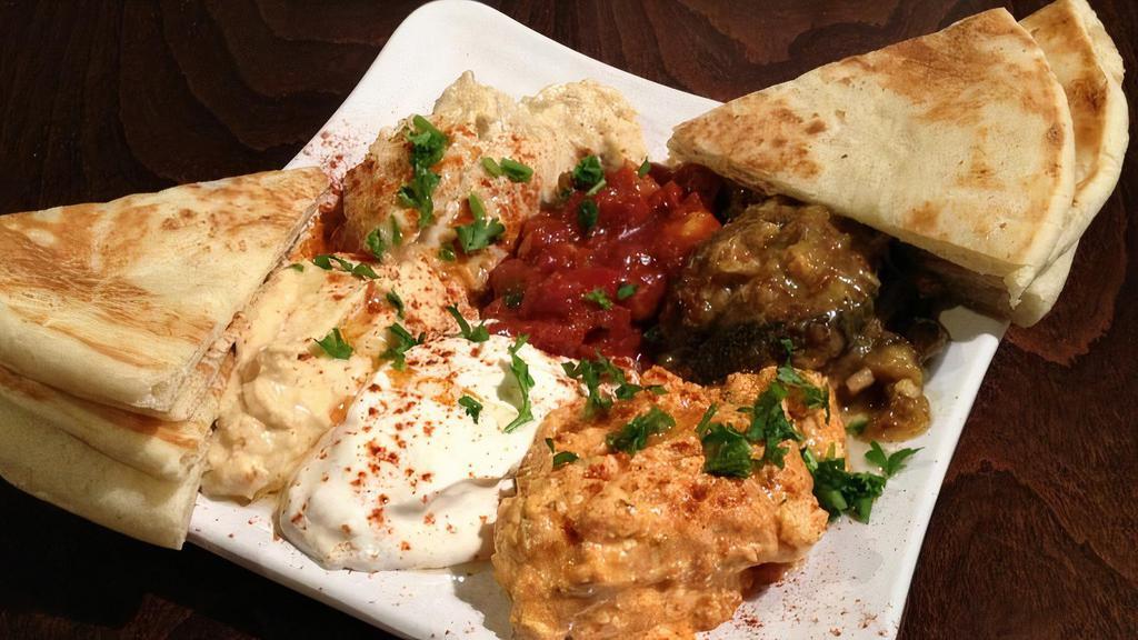 Mezze Plate (Pick 3) · Most popular. Your choice of any three appetizers.