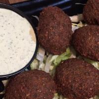 Falafel (5Pc) · Jerusalem-style ground chickpeas and fresh herbs, fried.