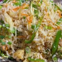 Veggie Fried Rice · Stir-fried mixed vegetables with cooked white rice tossed in Indian masala in Chinese style.