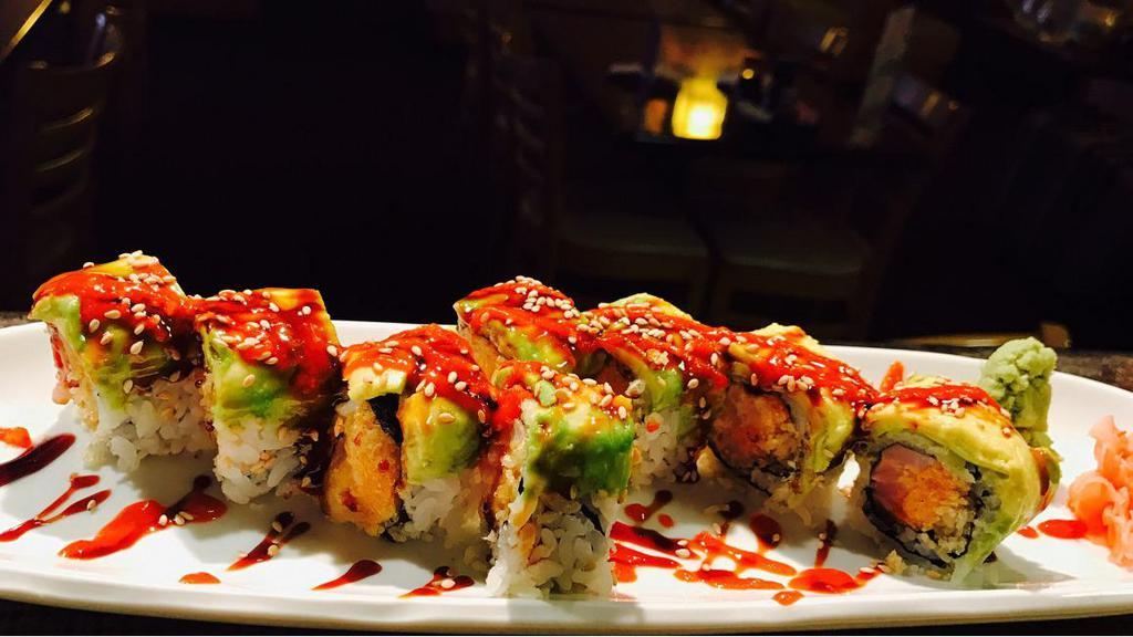 Spicy Dragon · White tuna and red snapper with spicy mayo and crunch inside. Avocado, spicy sauce, and sweet eel sauce on top.