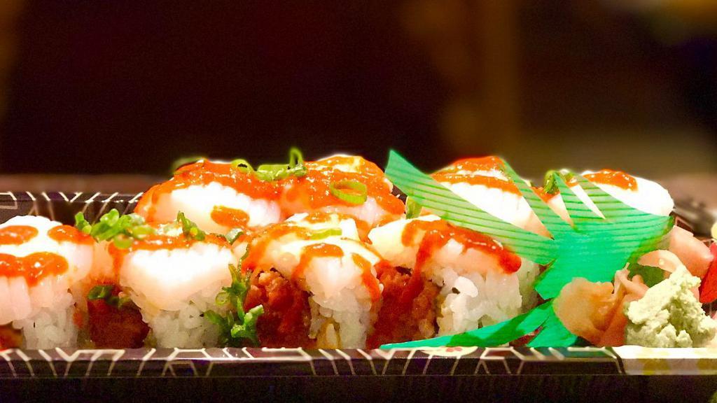 Halloween Roll · Spicy tuna inside. Cuttle fish and spicy sauce on top.