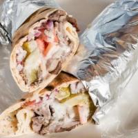 Beef Shawarma Wrap · Marinated beef slowly cooked on a rotisserie. Thinly sliced and wrapped in fresh pita bread ...