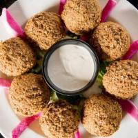 Regular Falafel Platter · A mixture of ground chickpeas and vegetables, deep-fried with spices.  Served with pickled t...
