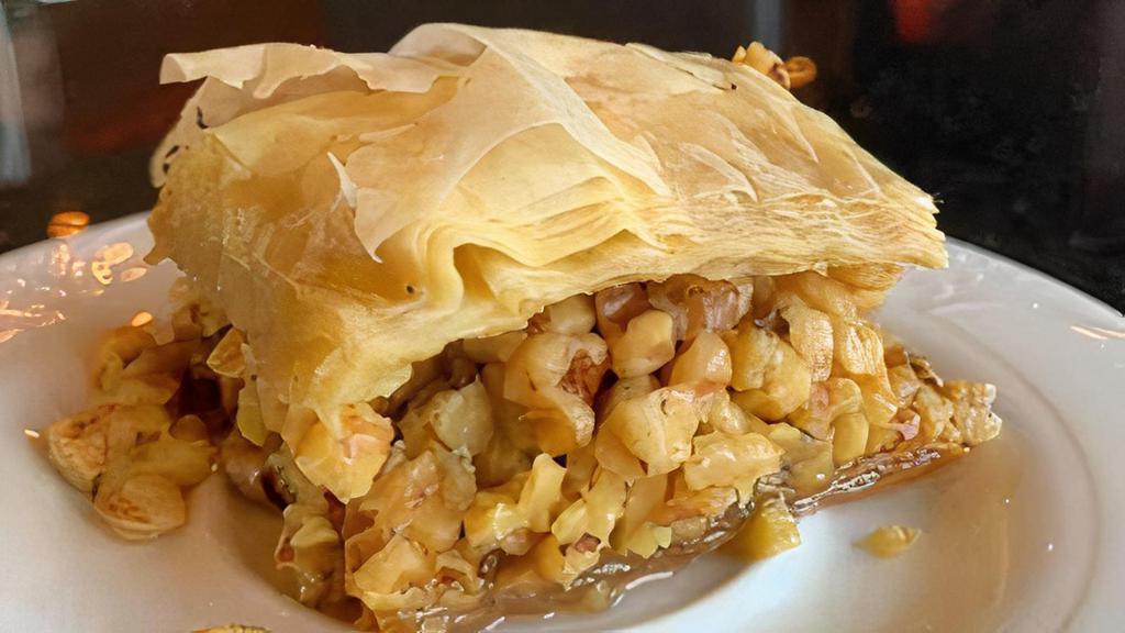 Baklava · A rich sweet pastry made of layers of film dough. Filled with chopped nuts and sweetened with honey.