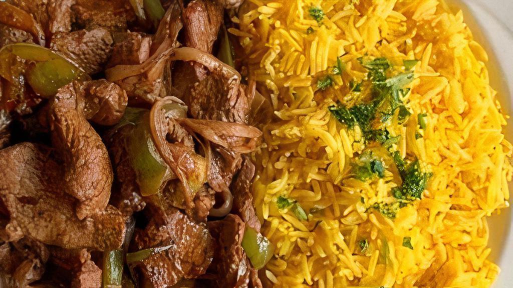 Beef Stir Fry · Sliced tenderloin, sautéed with onions and green peppers.  Topped with a combination of spices and served with basmati rice.