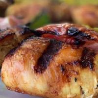 Chicken Shish Kabob · Flavorful cubes of marinated chicken, seasoned, and charcoal grilled with tomatoes, green pe...