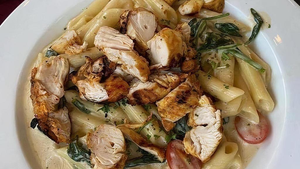 Chicken Tahini Pasta · Penne pasta tossed with spinach, tomatoes, and a creamy tahini sauce.  Topped with chicken.