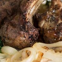 Lamb Chops · Three grilled, five oz. lamb chops topped with caramelized onions. Served with baby spinach ...
