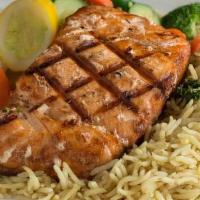 Grilled Salmon · Grilled salmon, seasoned with hints of lemon and garlic. Served with steamed vegetables and ...