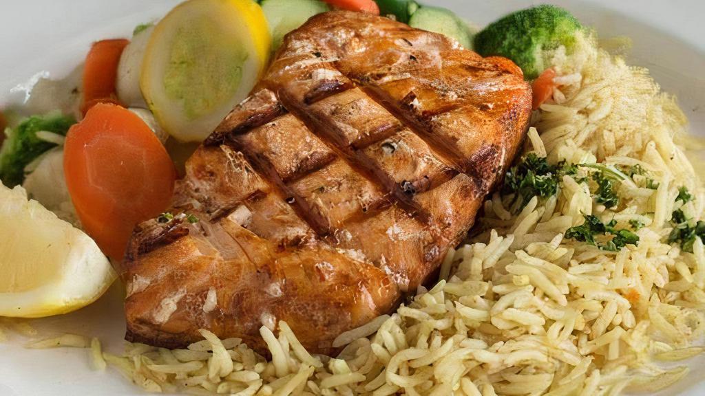 Grilled Salmon · Grilled salmon, seasoned with hints of lemon and garlic. Served with steamed vegetables and basmati rice.