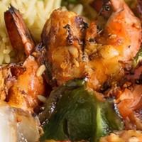 Moroccan Shrimp Kabob · Jumbo shrimp marinated in lemon, vinegar, and olive oil. Seasoned and charcoal grilled. Serv...