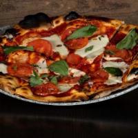 Margherita Pizza · fresh mozzarella, tomatoes, olive oil, basil