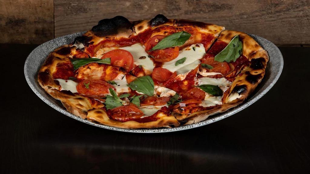 Margherita Pizza · fresh mozzarella, tomatoes, olive oil, basil