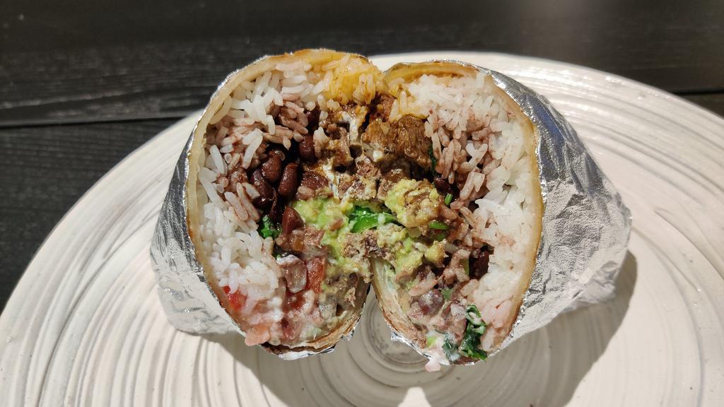 House Burrito · A Burrito consisting of, meat, rice, black beans, cheese, pico, green onions, sour cream, guacamole, and a splash of hot sauce. all wrapped in a warm 14