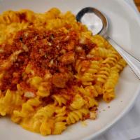 Classic Mac N Cheese · Spiral macaroni, cheddar cheese and cream. Baked with smoked gouda and cheddar. Sprinkled wi...