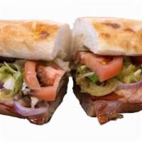The Italian Sandwich · Black forest ham, Italian dry salame, pepperoni, capicola, provolone cheese, pepperoncini pe...
