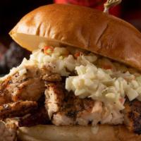 Moo’Ing Chicken · BBQ chicken over a bed of beef bacon topped with our house coleslaw.