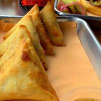 Smoked Samosas · 5 Samosas filled with brisket bits, Cheddar cheese, caramelized onions and bell peppers. Ser...