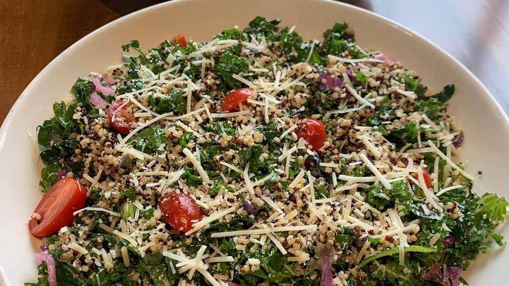 Quinoa Kale Salad · Kale, cherry tomatoes, pickled onions, shredded Parmesan and quinoa with a lemony vinaigrette dressing.