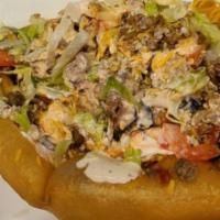 Taco Salad · Crispy flour tortilla shell filled with taco beef or chicken, iceberg lettuce, shredded chee...