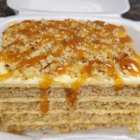 Biscuit Cake · Layered Biscuit cake topped with walnuts and caramel drizzle