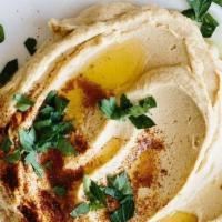 Our Signature Hummus · Blended chickpeas, tahini, olive oil and lemon juice.