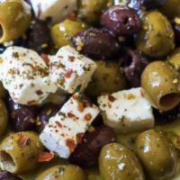 Feta Cheese & Olives · Topped with olive oil, parsley, paprika and served with pita bread.