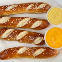 Bavarian Pretzel Sticks · Served warm and soft with a side of Merkts Cheddar cheese dipping sauce.