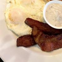 Country Fried Steak & Eggs · Country Fried Steak, Homemade Sausage Gravy, Two Eggs and Choice of Toast