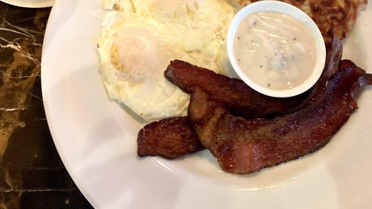 Country Fried Steak & Eggs · Country Fried Steak, Homemade Sausage Gravy, Two Eggs and Choice of Toast