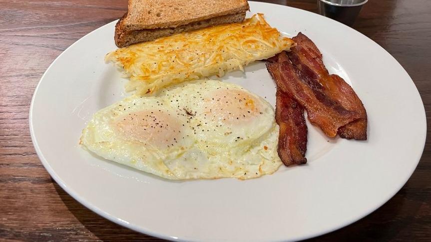 Easy Eggs · Made-to-order eggs, Jon's natural bacon and toast. Add pancakes for an additional charge.