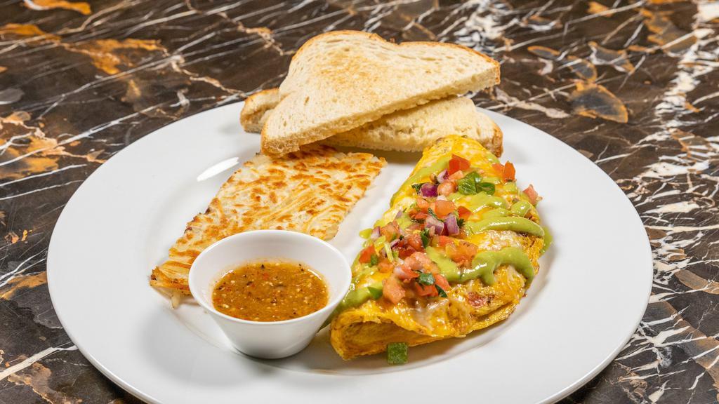 Meggzican Omelet · Shredded sirloin steak, serrano pepper, jalapeño, guacamole sauce and Cheddar Jack cheese, tomato, onion, and cilantro served with hash browns and toast.