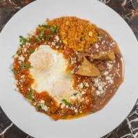 Huevos Rancheros · Over easy eggs, salsa ranchera, queso fresco, sliced avocado, red onions and cilantro served...