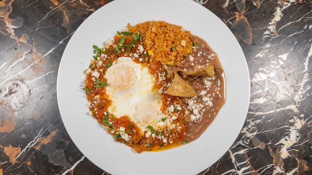 Huevos Rancheros · Over easy eggs, salsa ranchera, queso fresco, sliced avocado, red onions and cilantro served with refried beans, rice and corn tortillas.