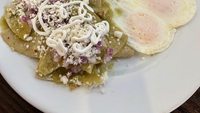 Chilaquileggs · Two Eggs, Corn Tortilla Strips, Red Onion, And Salsa Verde Topped with Queso Fresco and Crema and Mexican Rice