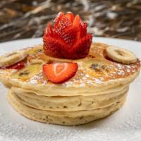 Pancakes · Tall stack of three pancakes. Served with Bacon or Sausage. Add fresh bananas, blueberries o...