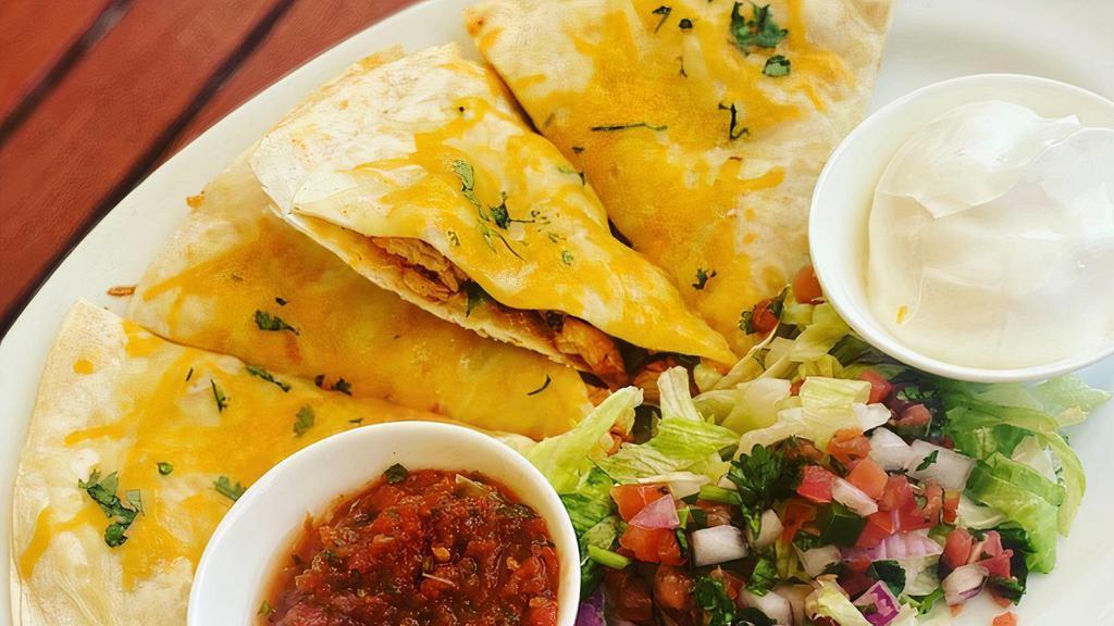 Quesadilla Fresca · Flour tortilla, Jack cheese, onion, cilantro garnished with lettuce, salsa pico and crema. Served with Mexican Rice and Beans.